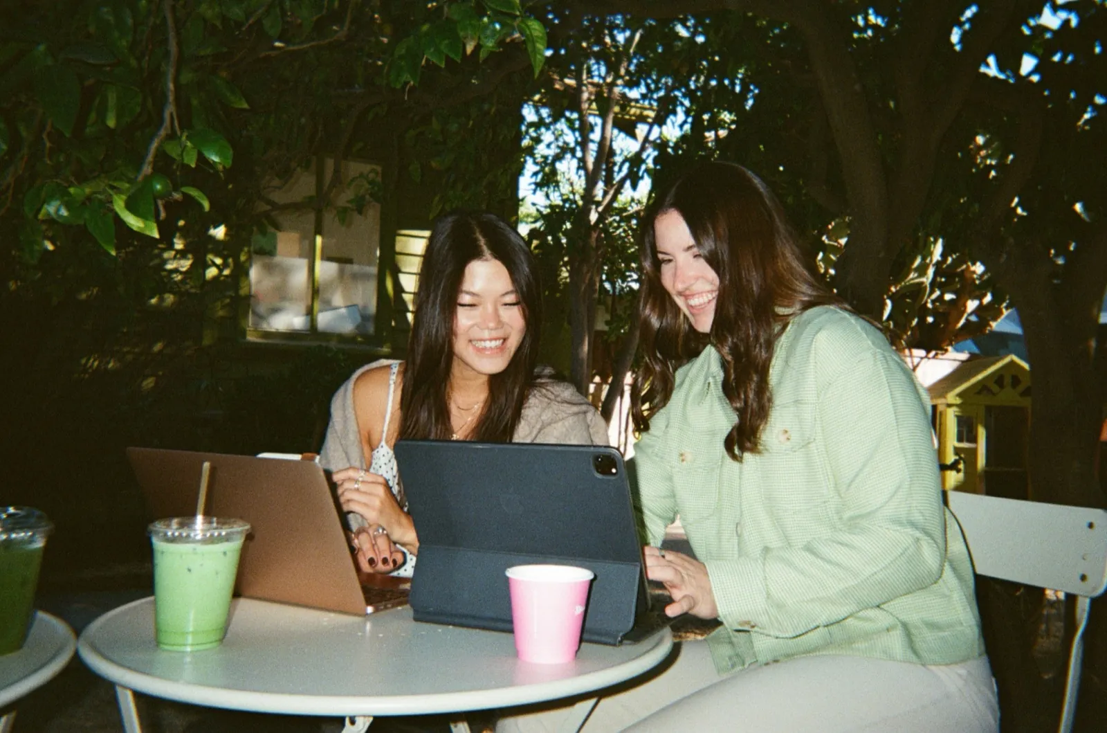 Women collaborating with AI tools in a bright studio